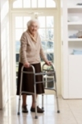 Old Woman with Walking Frame by Window